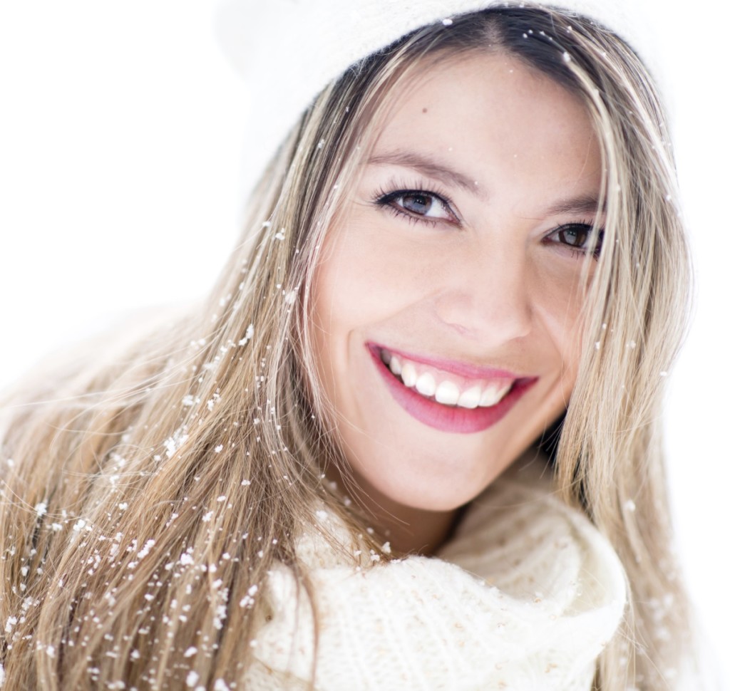 Winter portrait of a beautiful woman smiling